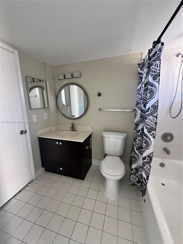 full bathroom with toilet, tile patterned flooring, vanity, and shower / tub combo with curtain