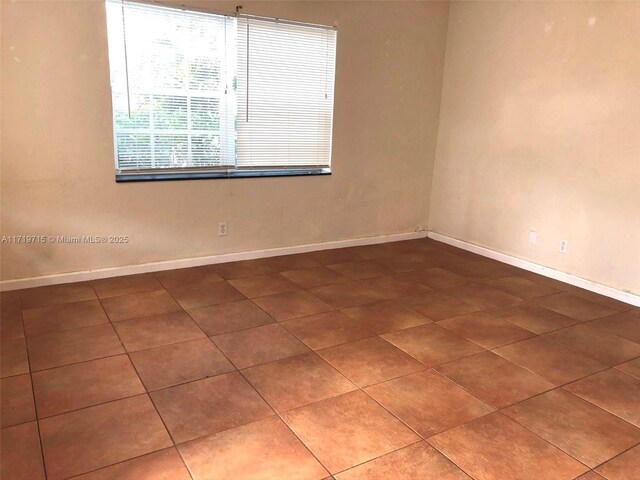 empty room featuring tile patterned flooring