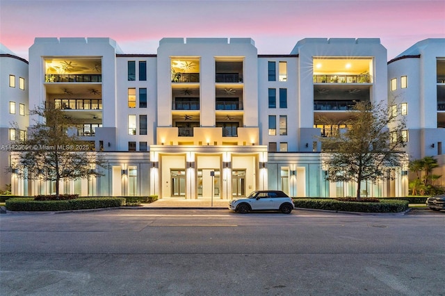 view of outdoor building at dusk