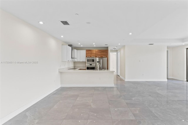 unfurnished living room with sink