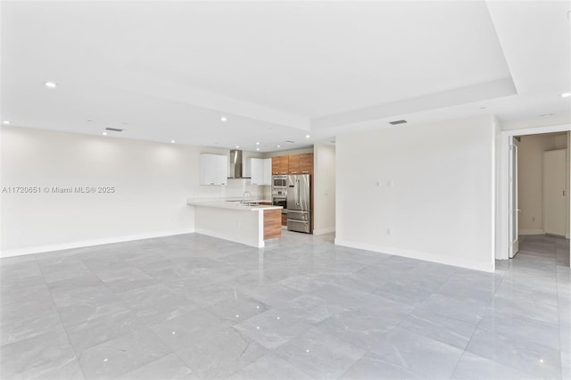 unfurnished living room with sink