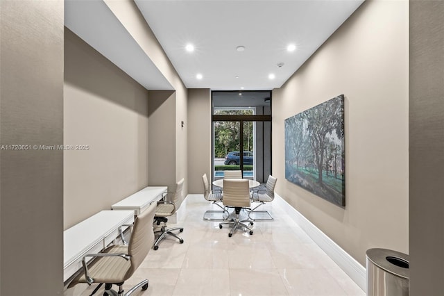 tiled office space with a wall of windows