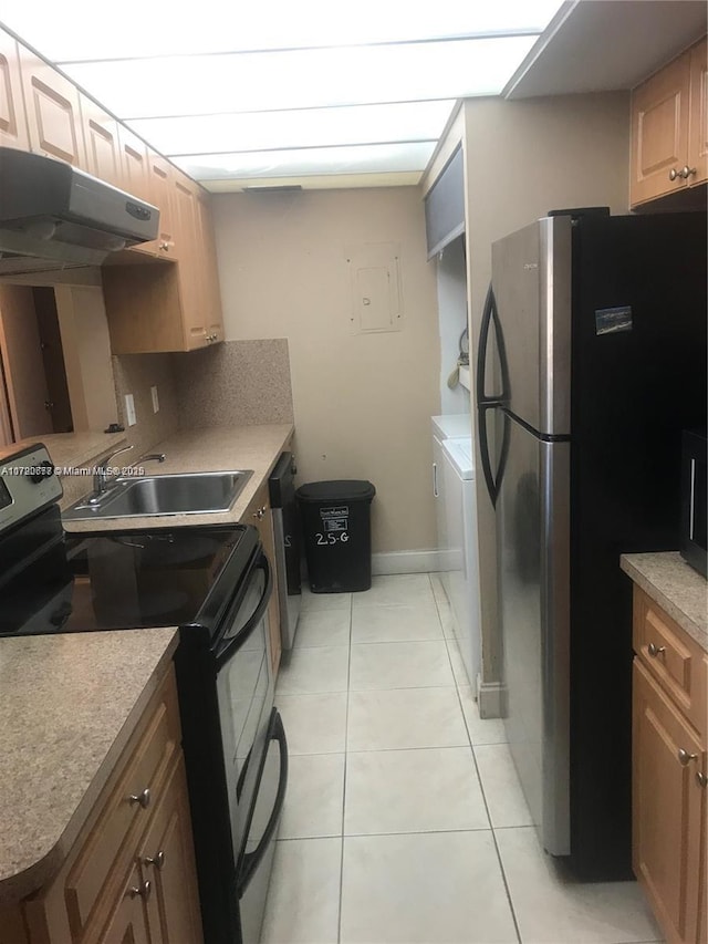 kitchen featuring ventilation hood, sink, washing machine and dryer, light tile patterned floors, and stainless steel appliances