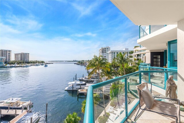 balcony with central AC unit and a water view