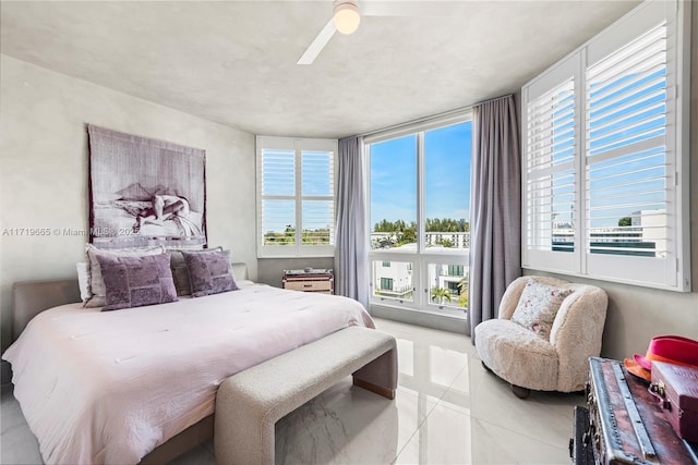 bedroom featuring light tile patterned floors and ceiling fan