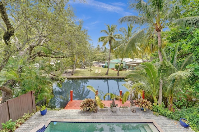 view of pool featuring a water view