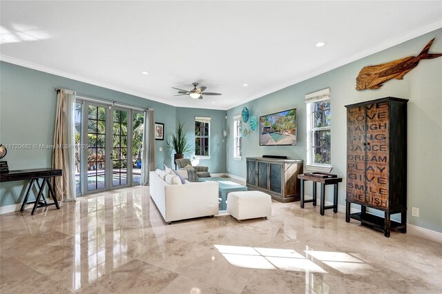 dining space with ceiling fan and ornamental molding