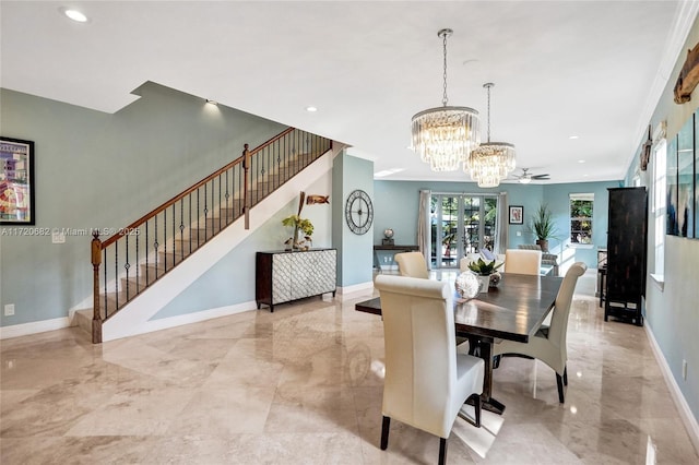 living room with marble finish floor, ornamental molding, and a healthy amount of sunlight