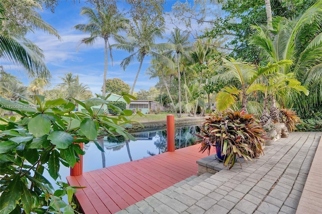 dock area with a lawn and a fenced backyard