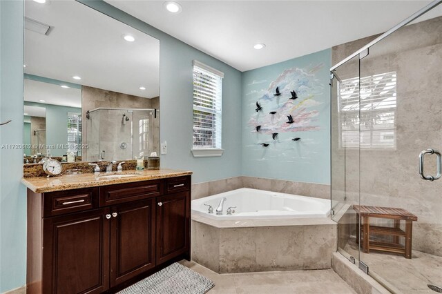 bathroom featuring vanity and separate shower and tub