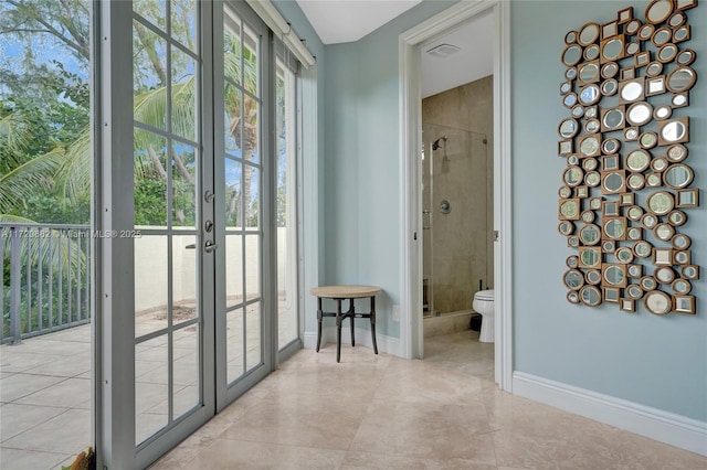 bedroom featuring french doors, baseboards, visible vents, wood finished floors, and access to outside