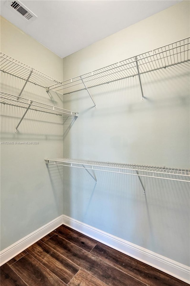 bedroom with french doors, visible vents, access to outside, and hardwood / wood-style flooring