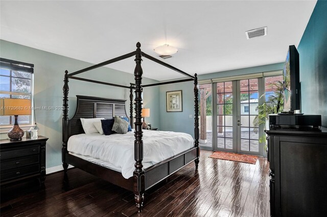 bedroom featuring multiple windows, visible vents, access to outside, and french doors