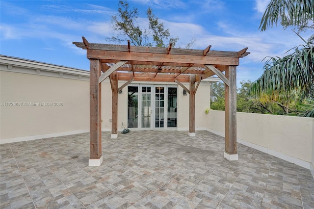 view of patio featuring a pergola and french doors