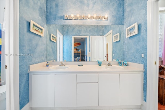 bathroom with toilet and vanity