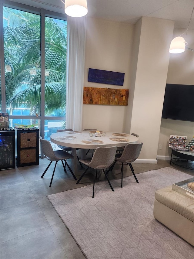 dining space with wine cooler and floor to ceiling windows