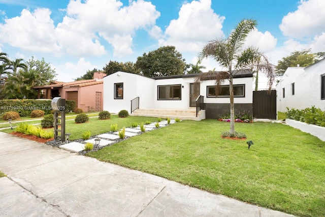 view of front of house with a front yard