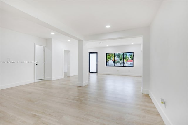 spare room with light hardwood / wood-style floors