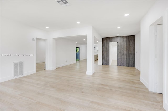 spare room with light hardwood / wood-style flooring