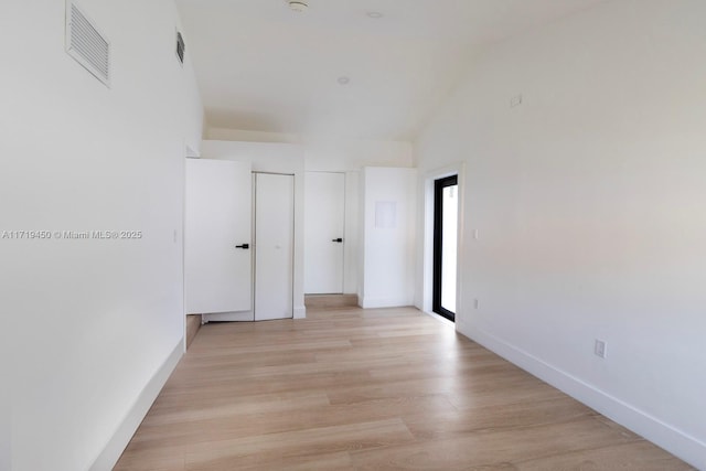 spare room with light hardwood / wood-style floors