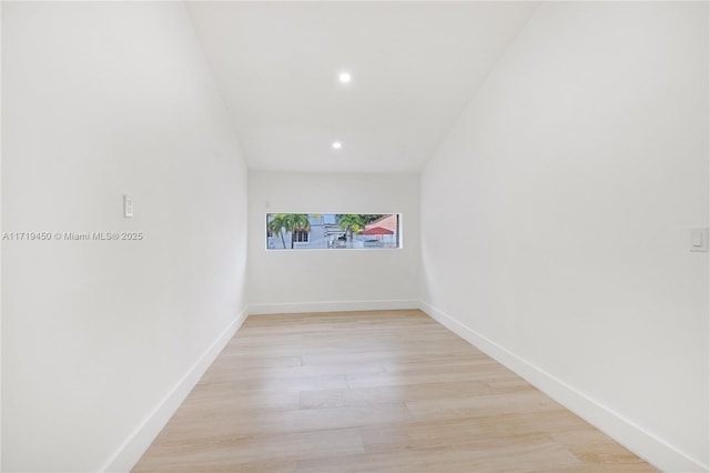 spare room with light hardwood / wood-style floors