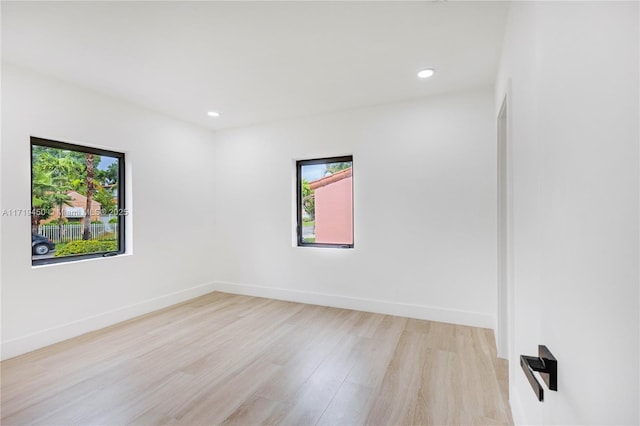 spare room featuring light hardwood / wood-style flooring