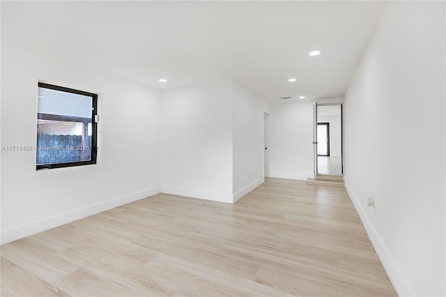 empty room with light wood-type flooring