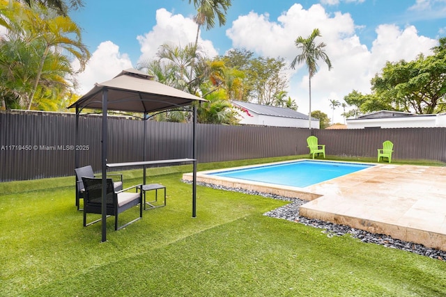 view of pool featuring a gazebo, a patio area, and a yard