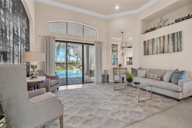 tiled living room with crown molding and a towering ceiling