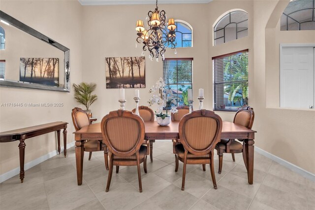 tiled dining area featuring a chandelier