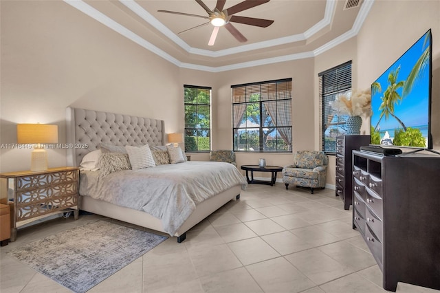 bedroom featuring a raised ceiling, ceiling fan, ornamental molding, and light tile patterned flooring