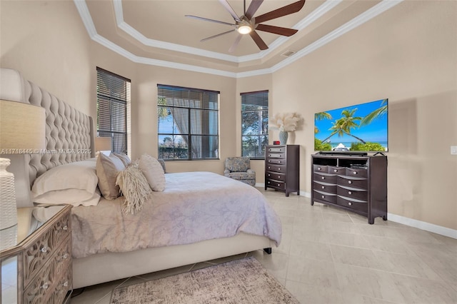 bedroom featuring light tile patterned floors, a raised ceiling, ceiling fan, and ornamental molding