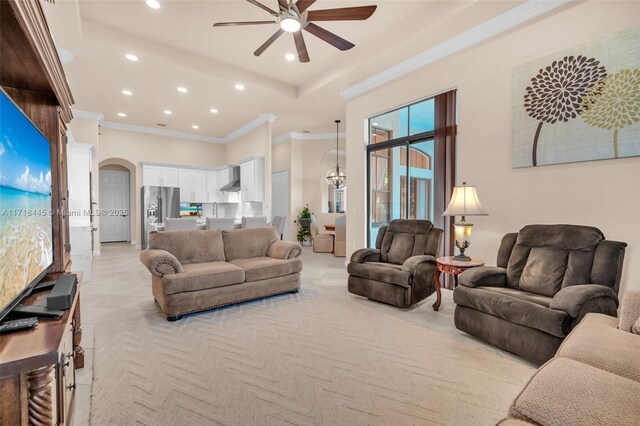 living room featuring ceiling fan and ornamental molding