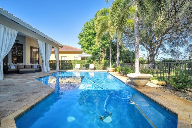 view of swimming pool with outdoor lounge area and a patio