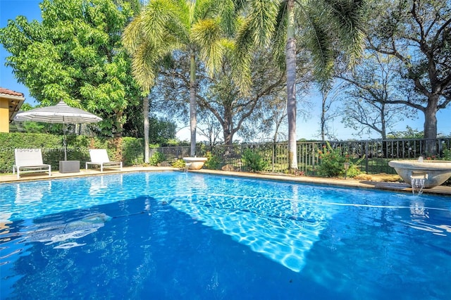 view of pool with pool water feature