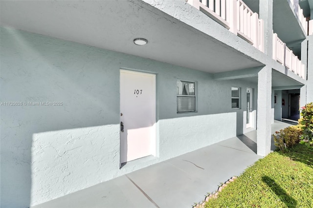 property entrance with a balcony