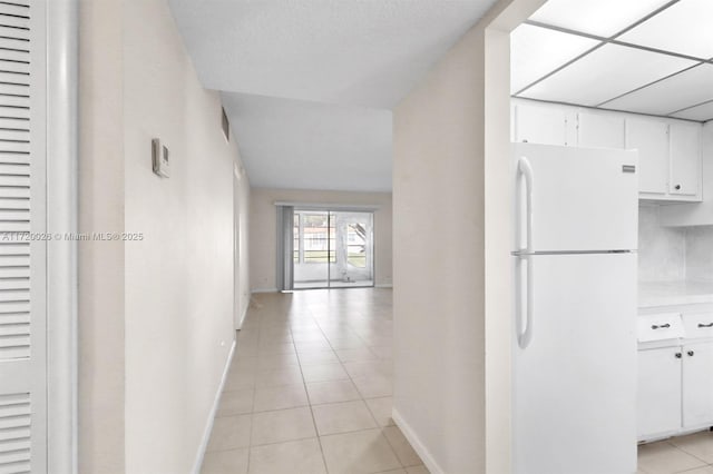 hallway with light tile patterned floors