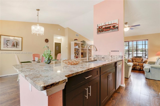 kitchen with ceiling fan with notable chandelier, sink, decorative light fixtures, dark hardwood / wood-style flooring, and dark brown cabinetry