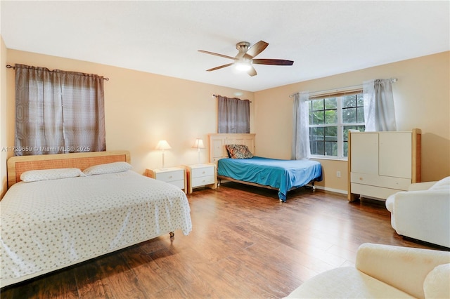 bedroom with hardwood / wood-style flooring and ceiling fan