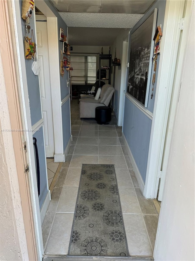 hallway featuring light tile patterned floors