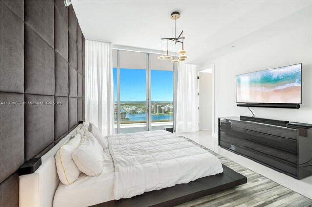 bedroom featuring floor to ceiling windows