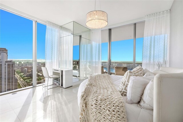 bedroom with expansive windows and light tile patterned floors