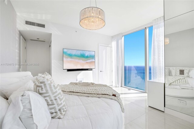 tiled bedroom featuring expansive windows