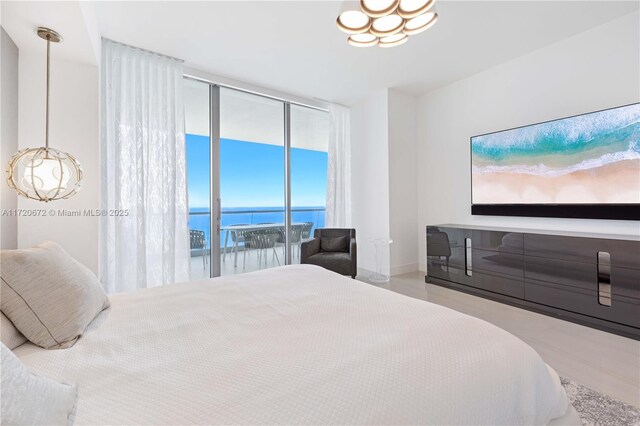 bedroom with access to outside and floor to ceiling windows