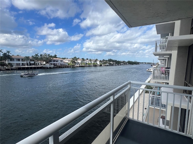 balcony featuring a water view