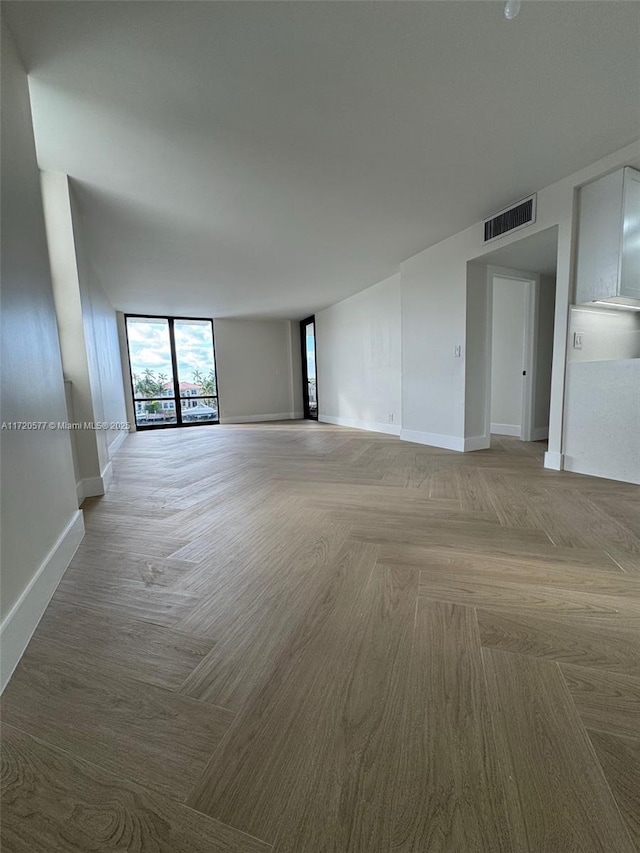 spare room featuring light parquet flooring