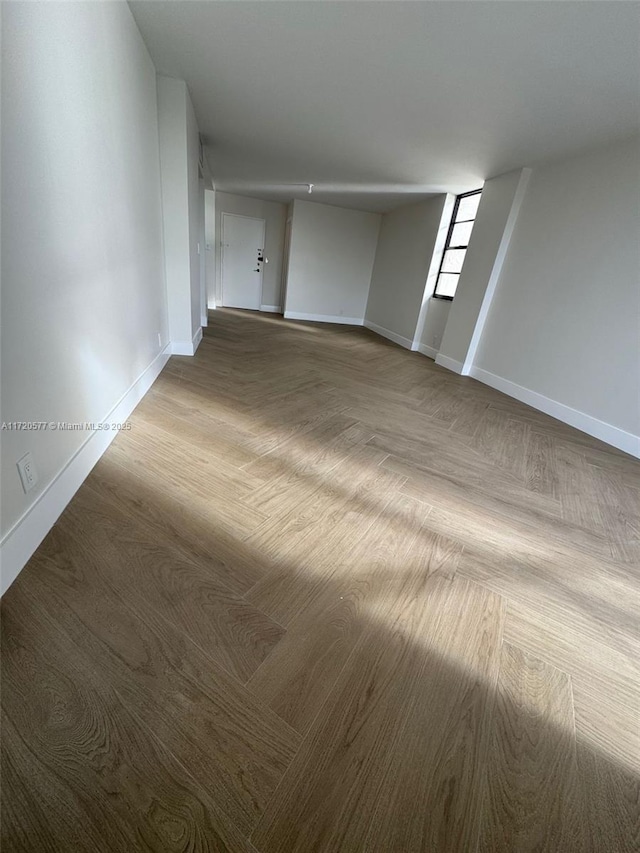 empty room featuring parquet flooring