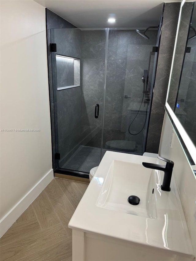 bathroom featuring walk in shower and sink