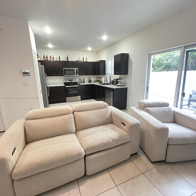 tiled living room featuring sink