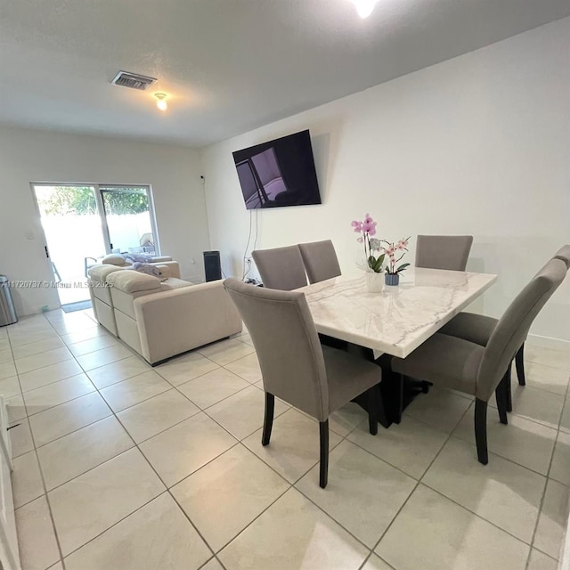 dining room featuring light tile patterned floors